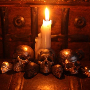 metal skull rings and candle holders