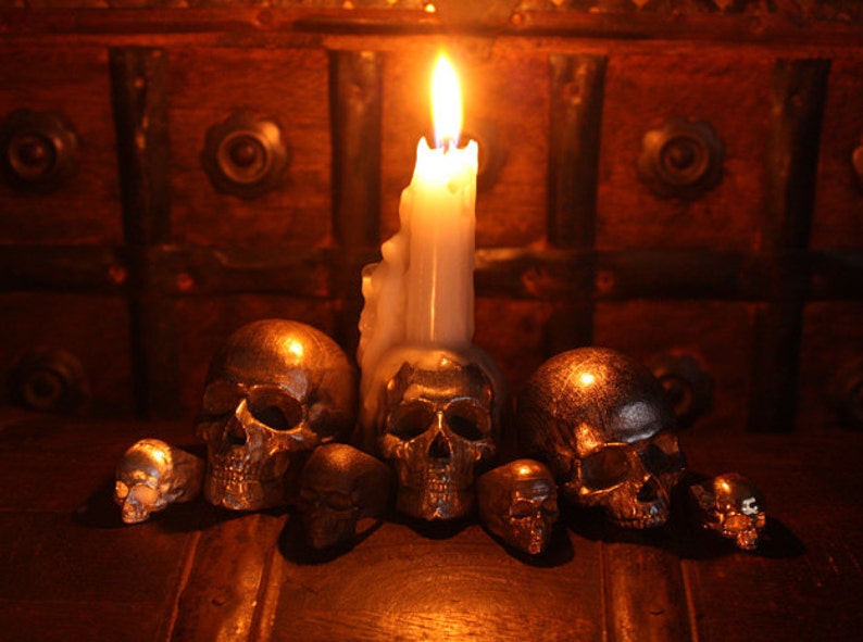 metal skull rings and candle holders