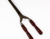 Antique Stove Top Heated Primitive Ladies Vanity Curling Iron Featuring Deep Rich Colored Wooden Handles With Unmarked Silver Tone Metal