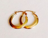 Vintage 14k Yellow Gold Designer Tapered Hoop Earrings Featuring Modern Hollow Finish