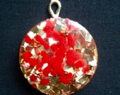 Vintage Lucite Glitter Round Designer Gold Tone Pendant Featuring Eclectic Red Speckled Design