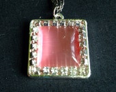 Vintage Rose Colored Opalescent Polished Rhinestone Pendant With Silver Tone Necklace Featuring Clear Rhinestone Accents