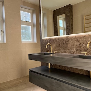 Contemporary single/double Corian vanity with hidden waste in Carbon Concrete veiny Corian