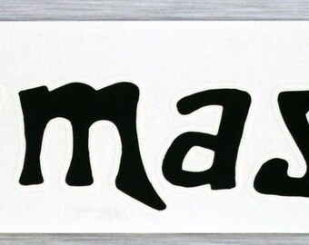 May include: A white rectangular sticker with the word "namaste" in bold, black, stylized lettering. The sticker is on a light gray surface.