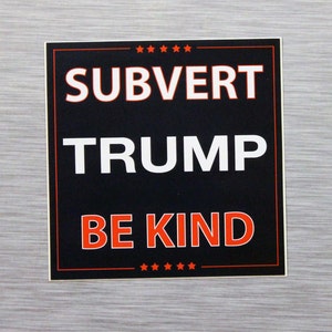 May include: Square sticker with the words "SUBVERT TRUMP BE KIND" in white and red lettering on a black background. The sticker has a red border and small red stars at the top and bottom.