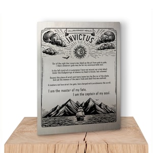 May include: A silver metal sign with a black and white illustration of a ship sailing on a stormy sea. The sign features the poem "Invictus" by William Ernest Henley, which reads: "Out of the night that covers me, black as the pit from pole to pole. I thank whatever gods may be for my unconquerable soul. In the fell clutch of circumstance I have not winced nor cried aloud. Under the bludgeonings of chance my head is bloody, but unbowed. Beyond this place of wrath and tears looms but the Horror of the shade. And yet the menace of the years finds and shall find me unafraid. It matters not how strait the gate, how charged with punishments the scroll. I am the master of my fate. I am the captain of my soul."