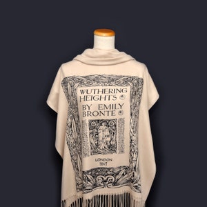 May include: A beige shawl with a black print of the book cover for "Wuthering Heights" by Emily Bront&euml;. The print includes the title, author, and publication date of 1847.