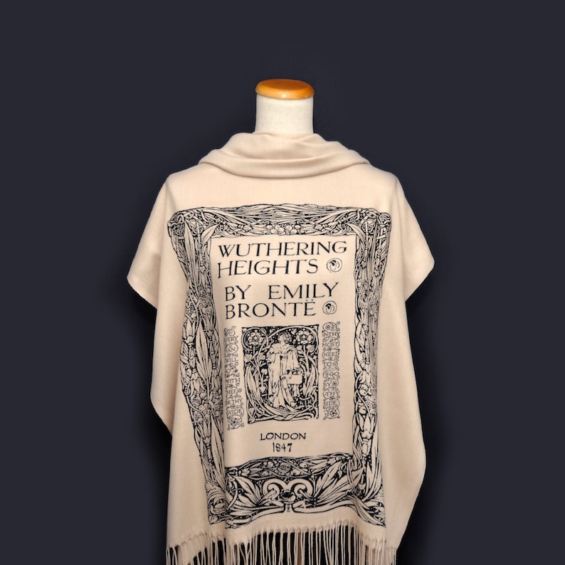 May include: A beige shawl with a black print of the book cover for "Wuthering Heights" by Emily Bront&euml;. The print includes the title, author, and publication date of 1847.