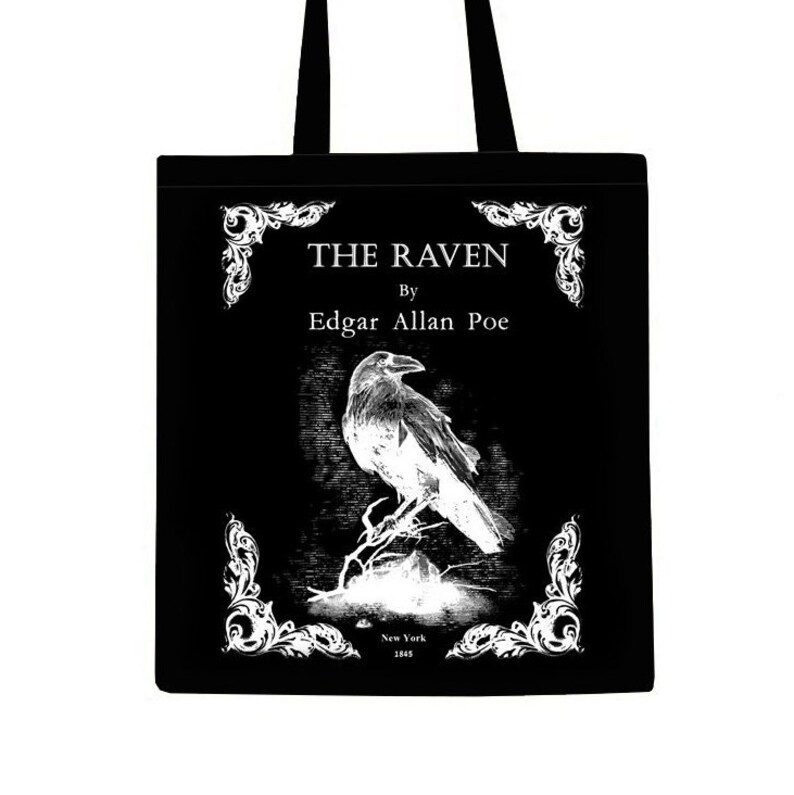 May include: Black tote bag with a white design featuring a raven, the title "The Raven" by Edgar Allan Poe, and the publication date "New York 1845".