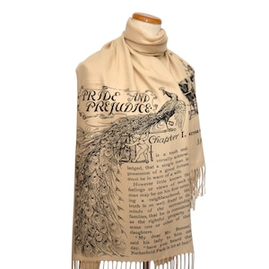May include: A beige scarf with a black and white print of a peacock and an excerpt from Jane Austen's Pride and Prejudice. The text reads "Chapter I. It is a truth universally acknowledged, that a single man in possession of a good fortune must be in want of a wife."