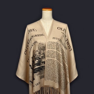 May include: A beige shawl with black text and an illustration from Charles Dickens's "Oliver Twist". The text includes the title of the book and the chapter "Treats of the Poor Law, and of the Circumlocution Office".