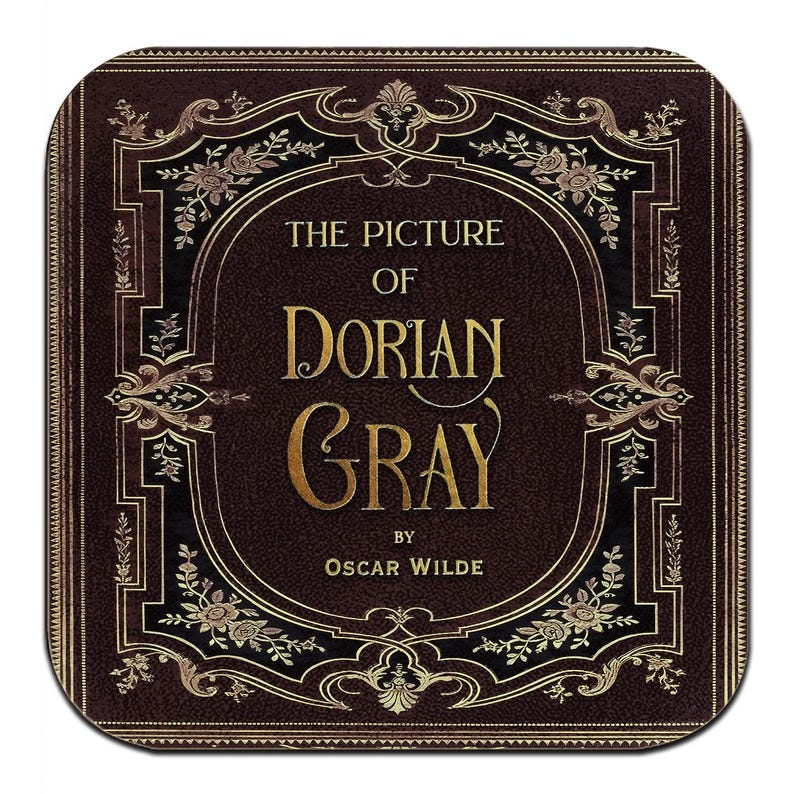 May include: A square coaster featuring the cover of "The Picture of Dorian Gray" by Oscar Wilde. The design has a dark brown background with gold floral and scrollwork accents. The title and author's name are in gold lettering.
