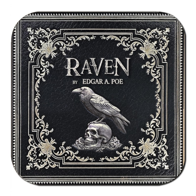 May include: Square black coaster featuring the title "RAVEN" by Edgar A. Poe. A silver raven is perched atop a skull. The border and text are in silver, with ornate scrollwork. The coaster has a textured appearance.
