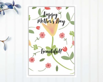 May include: A white card with a floral pattern and the text "Happy Mother's Day Beautiful!" in black.