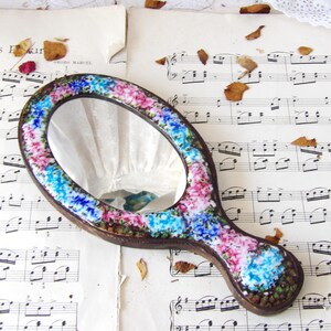 Vintage Copper Hand Mirror on Wood