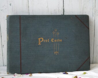 Album de cartes postales antique en tissu bleu