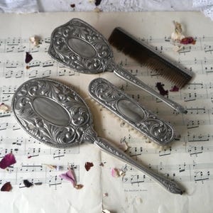 Vintage Embossed Metal Hand Mirror with Brushes and Comb