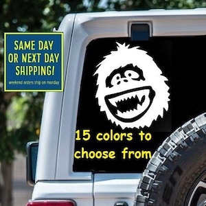 May include: A white Jeep Wrangler with a white Yeti sticker on the back window. The sticker says "15 colors to choose from".