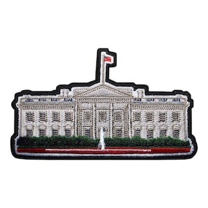 May include: Embroidered patch featuring the White House with a red flag on top. The patch has a black border, detailed stitching, and includes green shrubbery and a red stripe at the bottom. The design is a detailed representation of the iconic building.