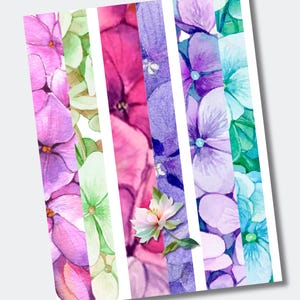 May include: A digital print featuring five vertical strips of watercolor hydrangea flowers in shades of pink, light green, magenta, deep purple, lavender, and bright blue, with a single white and green flower blossom centered over the strips.
