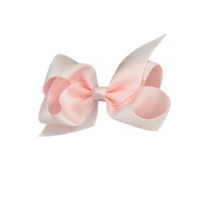 May include: A pale pink satin ribbon bow.