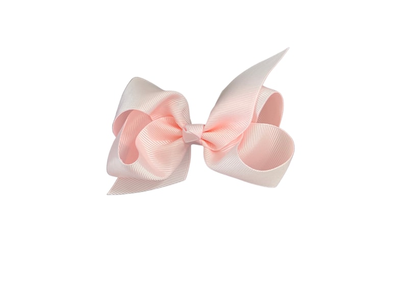 May include: A pale pink satin ribbon bow.