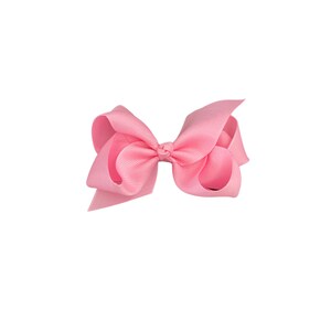 May include: A pink hair bow with a simple, classic design. The bow is made of a soft, silky fabric and is perfect for adding a touch of elegance to any hairstyle.