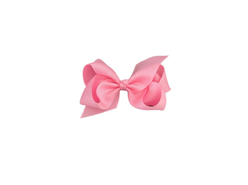 May include: A pink hair bow with a simple, classic design. The bow is made of a soft, silky fabric and is perfect for adding a touch of elegance to any hairstyle.