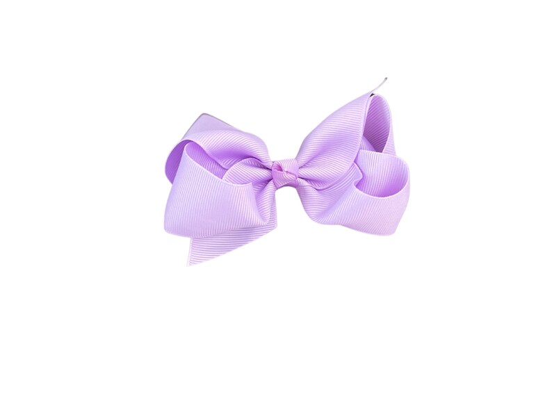 May include: A large, lavender-colored bow made of ribbon. The bow is tied in a classic style with two loops and a center knot.