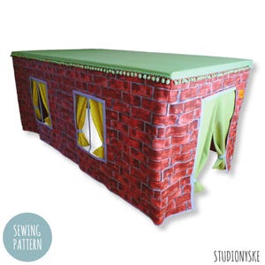 May include: A red brick playhouse tent with a green roof and two windows. The tent has a green curtain entrance.