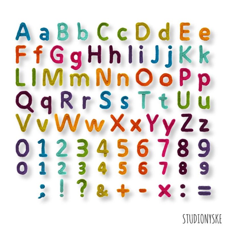 May include: A colorful collection of crocheted letters, numbers, and symbols. The alphabet includes uppercase and lowercase letters in various colors. Numbers 0-9 are also displayed, along with punctuation and math symbols. The image is set against a white background.