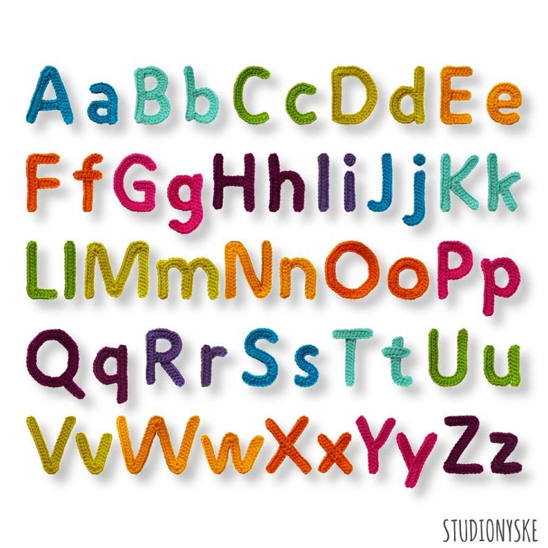 May include: A colorful alphabet made of crocheted yarn. Each letter is a different color, including red, orange, yellow, green, blue, purple, and pink.