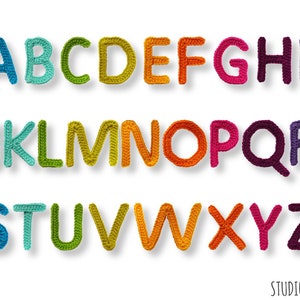 May include: A full alphabet of colorful, crocheted letters, each in a different hue, from blue to purple. The letters are arranged in rows, with a slight shadow effect, and are set against a white background. The letters are handmade and appear to be soft and textured.