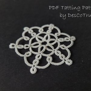 May include: A white crocheted snowflake pattern, a PDF tatting pattern by DesCoTru.