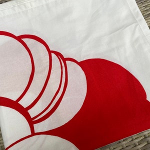 May include: White fabric with a red abstract design. The design is made up of overlapping circles and semi-circles.