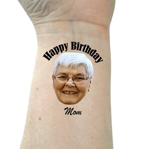 May include: A temporary tattoo with a photo of a woman and the text "Happy Birthday Mom".