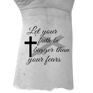 May include: Black and white image of a cross with the text "Let your faith be bigger than your fears".