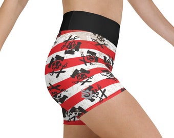 May include: Red and white striped athletic shorts with a black waistband and a skull and crossbones pattern.