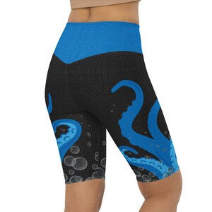 May include: Black and blue leggings with an octopus design and white bubbles. The leggings have a blue waistband.