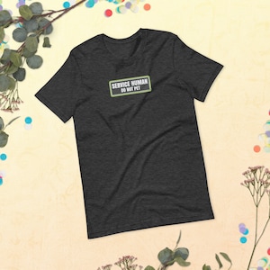 May include: A dark grey t-shirt with a green patch that says "SERVICE HUMAN DO NOT PET".