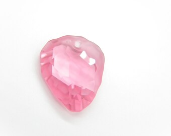 May include: A pink crystal heart-shaped pendant with a hole at the top for stringing.