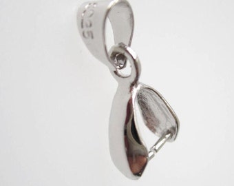 May include: Silver-toned pendant bail with a spring clasp. The bail is marked with "925" indicating it is made of sterling silver.