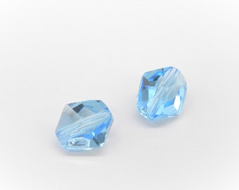 May include: Two light blue faceted glass beads with a clear center.