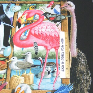 May include: A colorful fabric panel with a variety of birds, including a pink flamingo, a bluebird, a red cardinal, and an ostrich. The fabric also features a white pelican, a yellow and blue parrot, and a group of seagulls. The fabric is printed with a wooden frame and a ruler that reads "Sew Much Fabric & More".