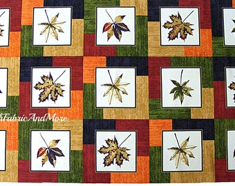 May include: A fabric with a repeating pattern of colorful leaves in squares. The leaves are in shades of green, brown, orange, and red. The fabric is perfect for quilting, crafts, and home decor.