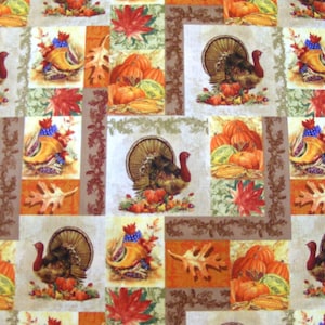 May include: A repeating pattern fabric featuring squares with Thanksgiving-themed illustrations. Each square showcases a turkey, pumpkins, cornucopias, and autumn leaves in shades of orange, brown, and green. The overall design evokes a festive fall atmosphere.