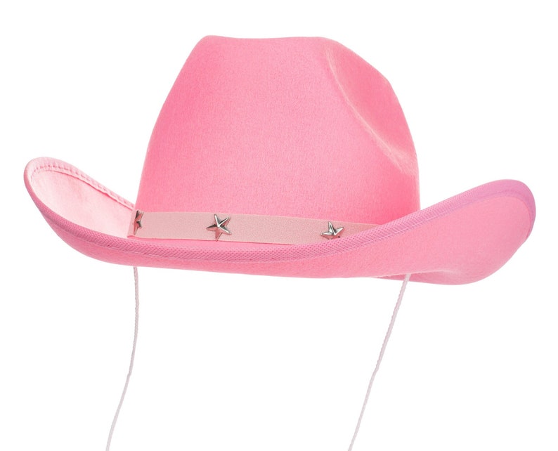 K&ouml;nnte beinhalten: Ein rosa Cowboyhut mit einem silbernen Sternendesign auf dem Band.