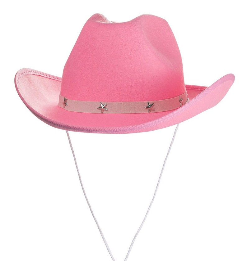 K&ouml;nnte beinhalten: Ein rosa Cowboyhut mit silbernem Sternensaum und einem wei&szlig;en Kinnriemen.