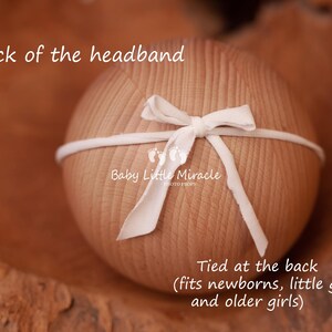 May include: White headband with a bow tied at the back. The headband is made of a soft, stretchy material and is designed to fit newborns, little girls, and older girls. The text "Baby Little Miracle" is printed on the headband.