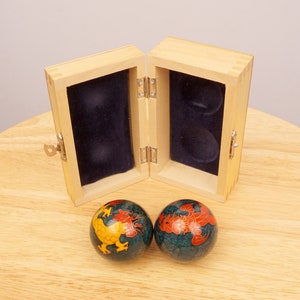 Chinese iron balls || Dragon design || Hinged wood lid || Original box || Fabric inlay || Music instrument